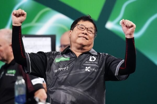 Paul Lim makes darts history as he becomes oldest player to win match at PDC World Championship | UK News