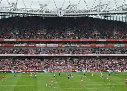 Emirates Stadium fans celebrate Arsenal win Premier League